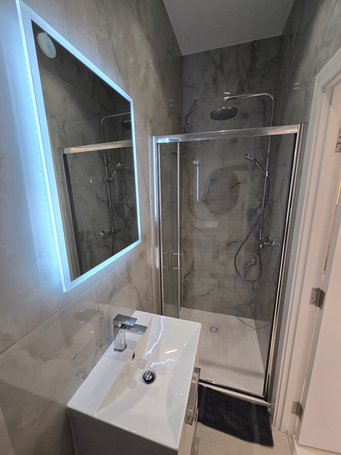Marble-tiled shower room