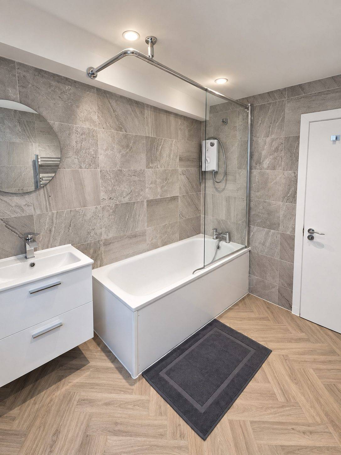 Bathroom with bath and shower screen