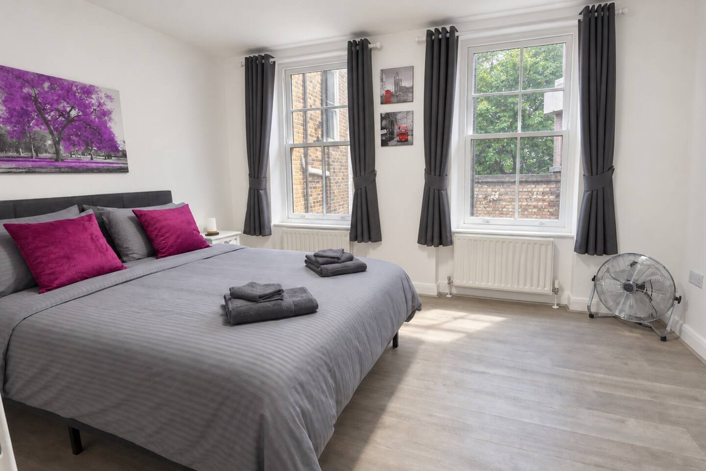 Front bedroom with tall sash windows